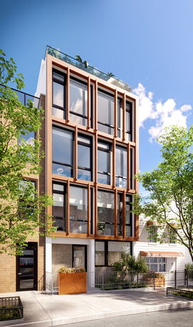 Front view of a modern multi-story building with large windows and wooden accents.