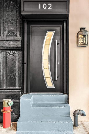 Front view of a modern building entrance with a unique door design.