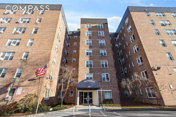 Front view of a multi-story brick building.
