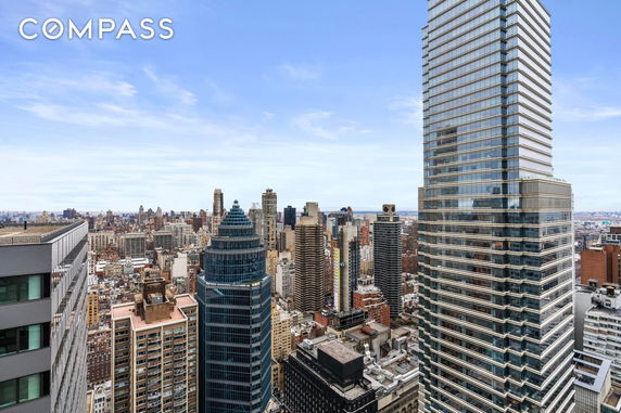 Panoramic view of city skyscrapers and urban skyline.