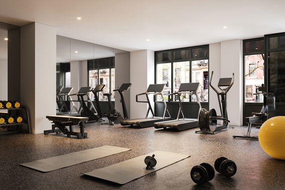 Interior view of a fitness gym with exercise equipment.