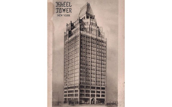 Front view of a tall skyscraper with a distinctive roof design.