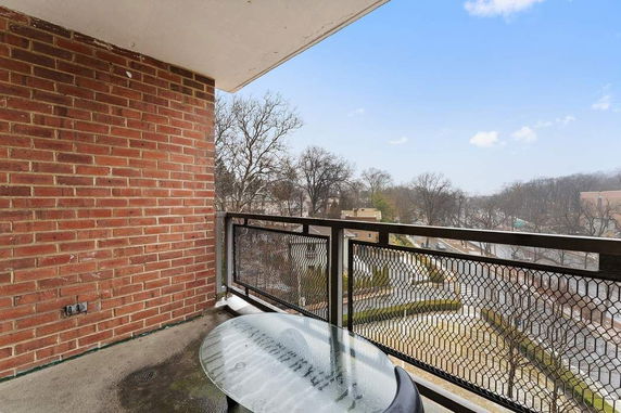 Balcony view of surrounding area from a brick building.