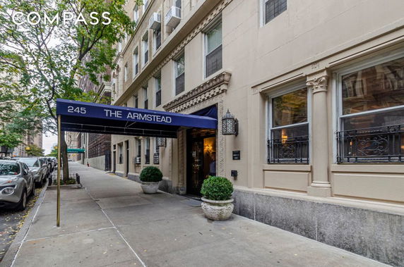 Front view of a multi-story building with a covered entrance.