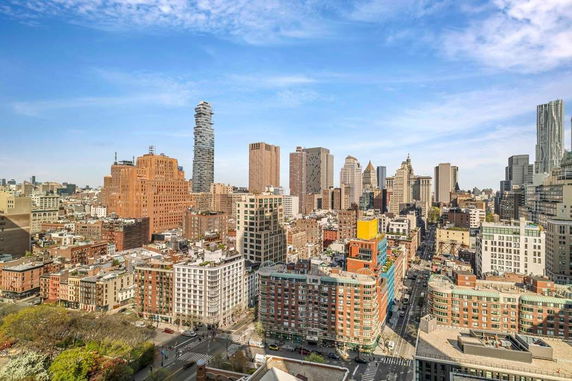 Panoramic view of a cityscape with various skyscrapers and buildings.