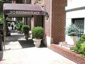 Front view of a building with a canopy over the entrance.