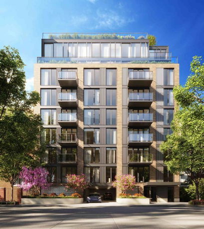 Front view of a modern multi-story apartment building with balconies.