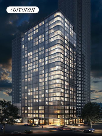 Night view of a illuminated high-rise building with glass facade.