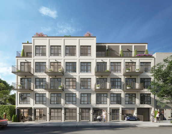 Front view of a multi-story apartment building with balconies.