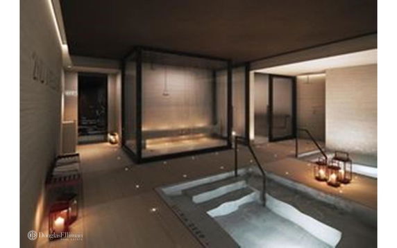 Indoor spa area with a pool and ambient lighting.