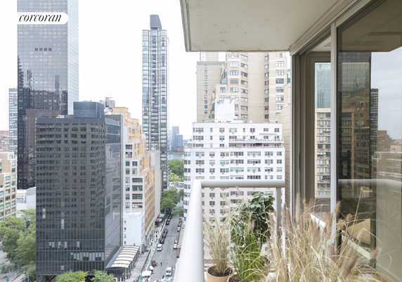 Panoramic view from a balcony showing various high-rise buildings in an urban area.