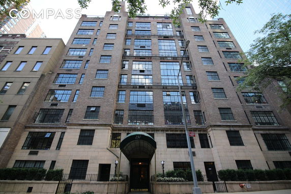 Front view of a multi-story brick apartment building.