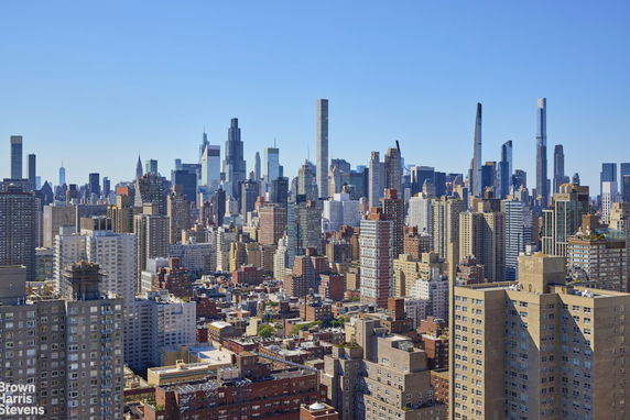 Wide-angle view of a city skyline with numerous skyscrapers.