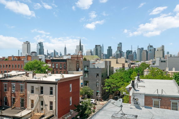 Panoramic view of city buildings and skyline.