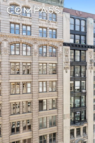 Front view of a multi-story building with ornate exterior detailing.