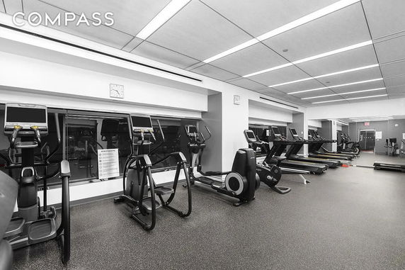 Gym area with exercise machines and treadmills.