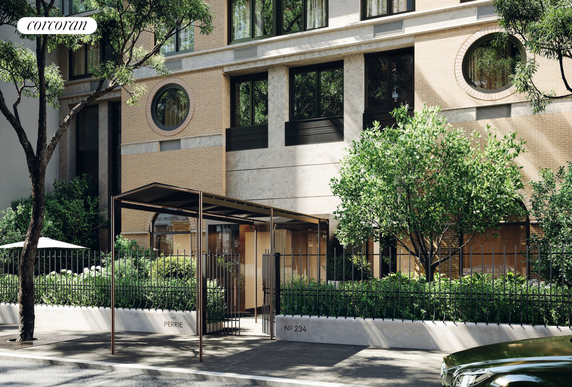 Front view of a multi-story building with a modern facade and entrance canopy.