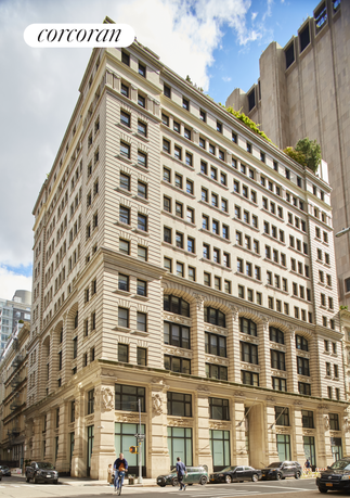 Front view of a multi-story historic building with intricate facade details.
