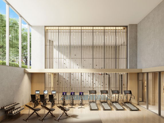 Interior view of a gym with treadmills and exercise equipment.