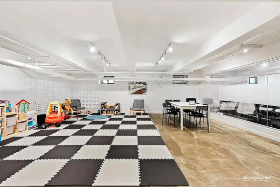 Interior view of a play area with toys and seating.