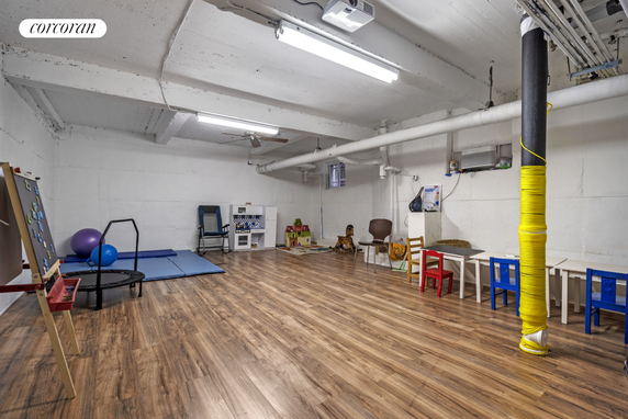 Room with toys and play equipment for children.