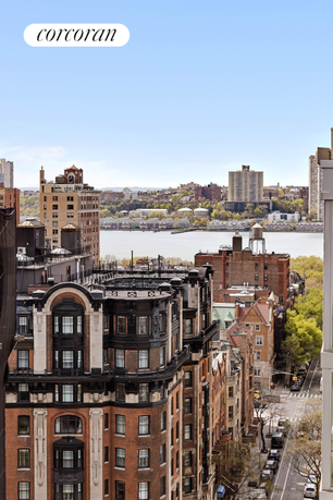 Panoramic view of a city with buildings and a river in the background