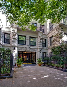 Front view of a multi-story residential building with decorative facade.