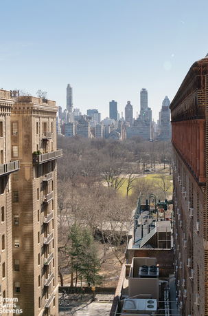 View of multiple high-rise buildings with a park and cityscape in the background.
