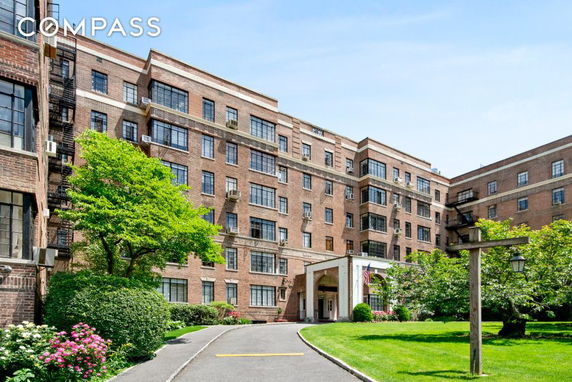 Front view of a multi-story brick apartment building