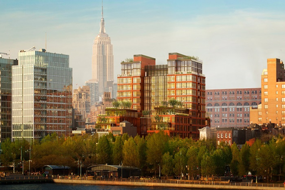 Front view of a modern multi-story building with large windows and terrace gardens.