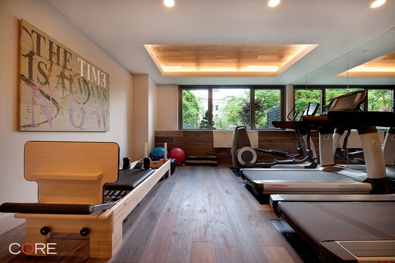 Indoor gym with treadmills and pilates equipment.