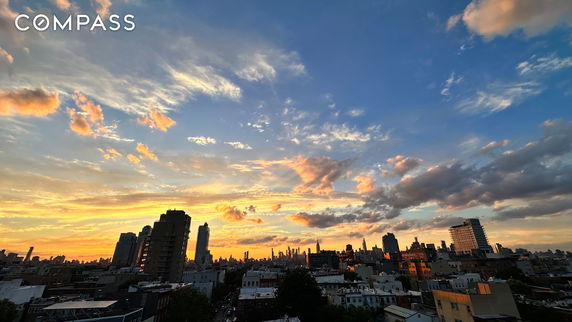 Wide angle view of a city skyline during sunset.