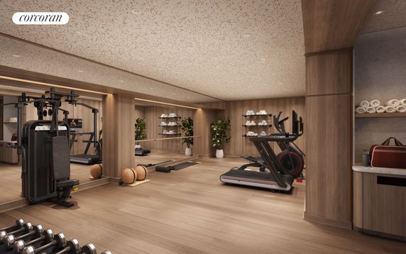 Interior view of a modern gym with exercise equipment and wood accents.