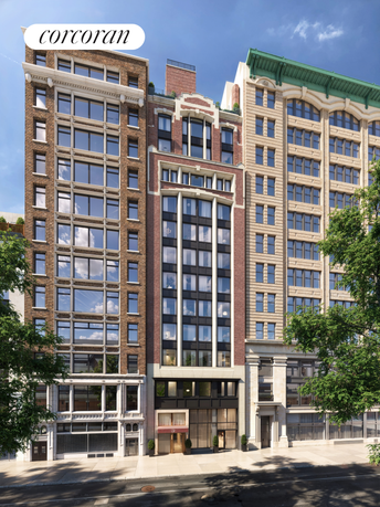 Front view of a multi-story building with large windows and decorative architectural elements.