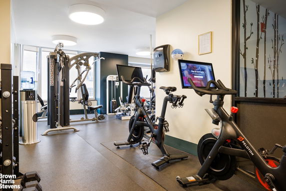 Indoor gym area with exercise bikes and fitness equipment.