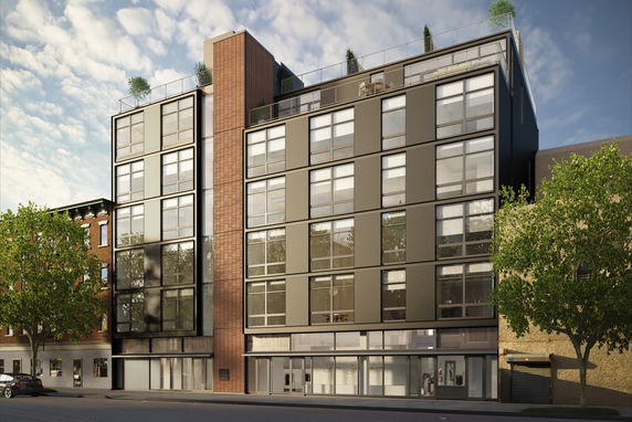 Front view of a multi-story modern apartment building with large windows.