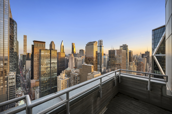 View of a city's skyline from a high vantage point with various skyscrapers and buildings.