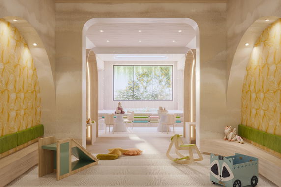 Interior view of a children's play area with toys and seating.