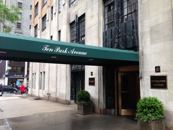Front view of a building with a green awning labeled 'Ten Park Avenue'.