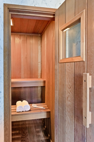 Interior view of a sauna room with wooden benches.