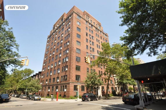 Front view of a multi-story brick apartment building.