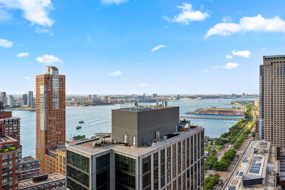 Wide angle view of city buildings and river.