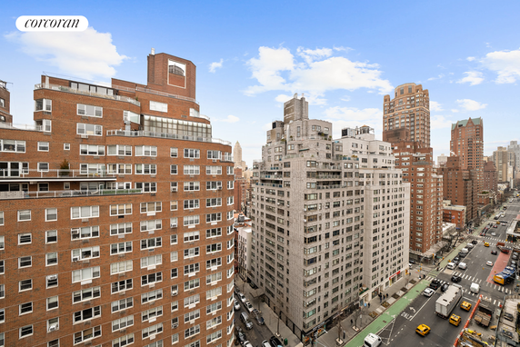 View of high-rise buildings in an urban area with a busy street below.
