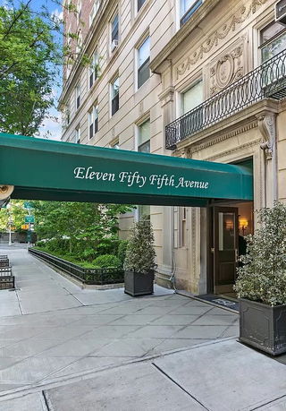 Front view of a building with an awning and entrance at Eleven Fifty Fifth Avenue.