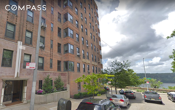 Front view of a multi-story brick building.