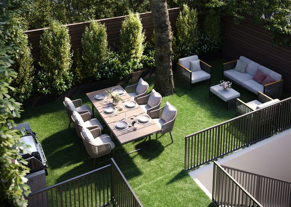 Outdoor area with a dining table, chairs, sofa set, and surrounding greenery.