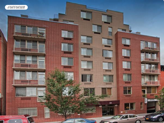 Front view of a multi-story brick apartment building.