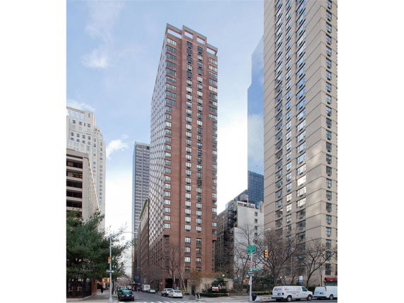 Front view of a tall residential apartment building.