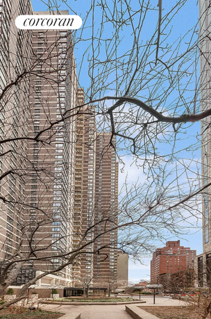 Front view of high-rise residential buildings with a walkway.