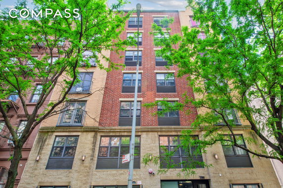 Front view of a multi-story brick building.